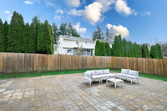 view of patio with outdoor lounge area and a fenced backyard