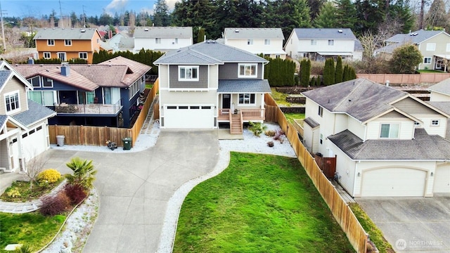 birds eye view of property with a residential view