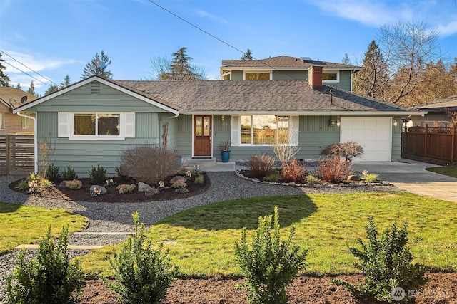 view of front of house with a front lawn, fence, concrete driveway, a garage, and crawl space