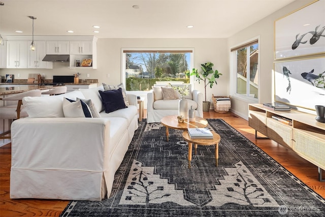 living area featuring recessed lighting and wood finished floors