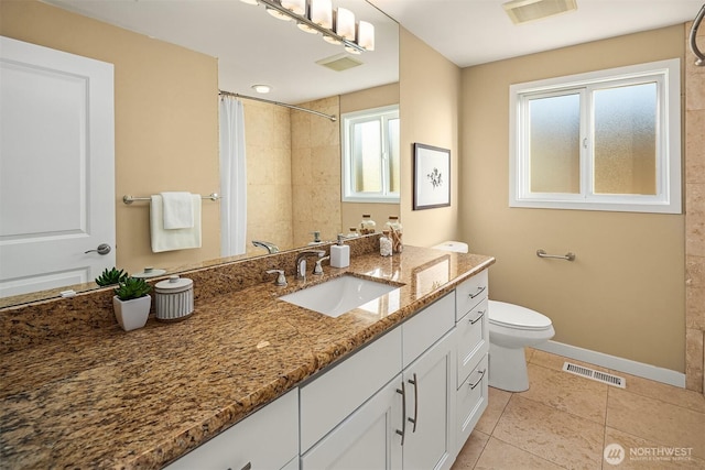 bathroom featuring tile patterned floors, visible vents, toilet, tiled shower, and baseboards