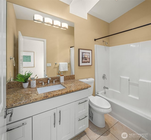 full bathroom featuring tile patterned floors, toilet, vanity, and shower / tub combination