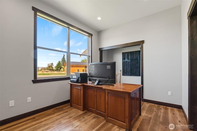 office with recessed lighting, light wood-style flooring, and baseboards
