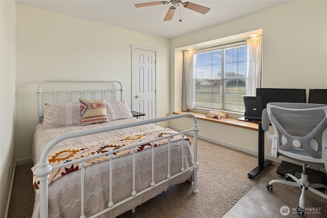 carpeted bedroom with a ceiling fan and baseboards