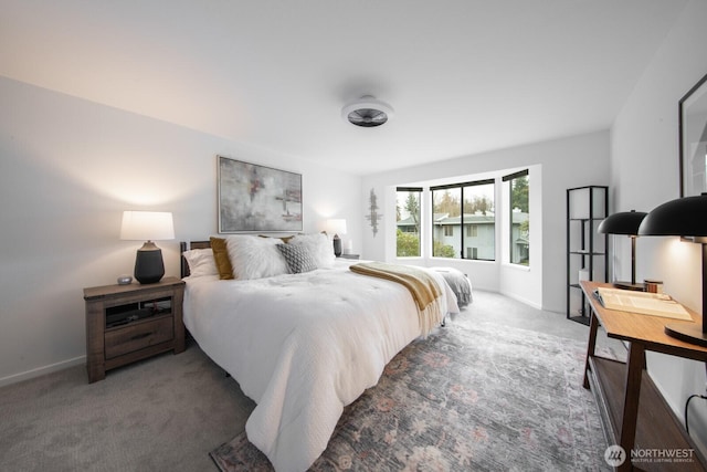 bedroom with baseboards and carpet floors