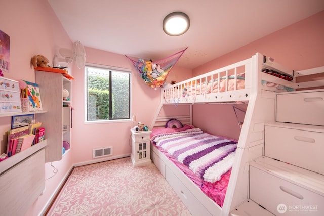 bedroom with baseboards and visible vents