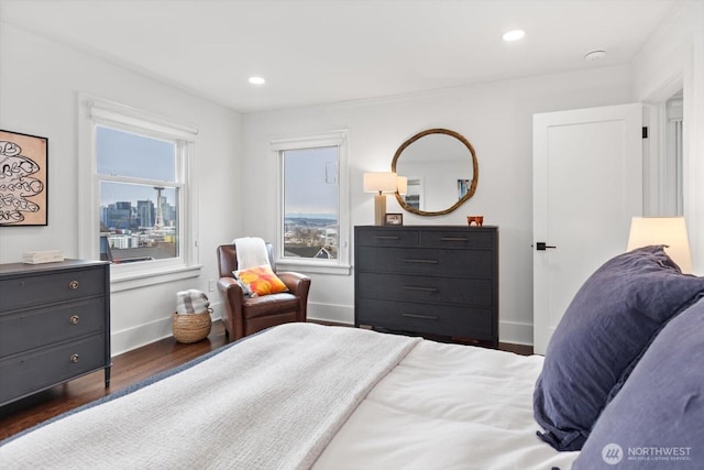 bedroom with recessed lighting, baseboards, and wood finished floors