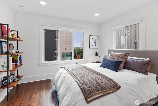 bedroom with recessed lighting, baseboards, and wood finished floors