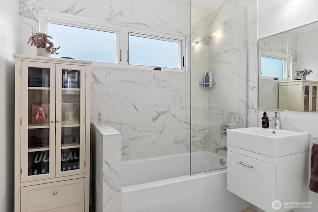 bathroom with vanity and washtub / shower combination