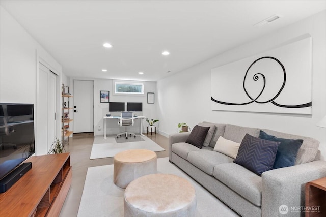 living room with recessed lighting, visible vents, and baseboards