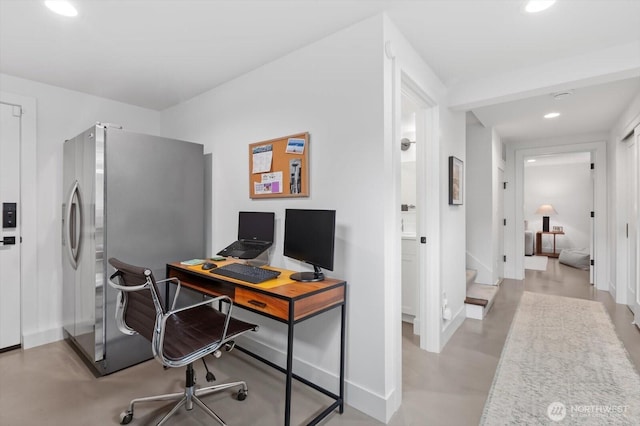 office with recessed lighting and baseboards