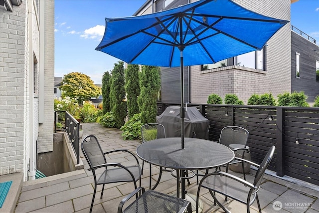 view of patio featuring grilling area and outdoor dining space