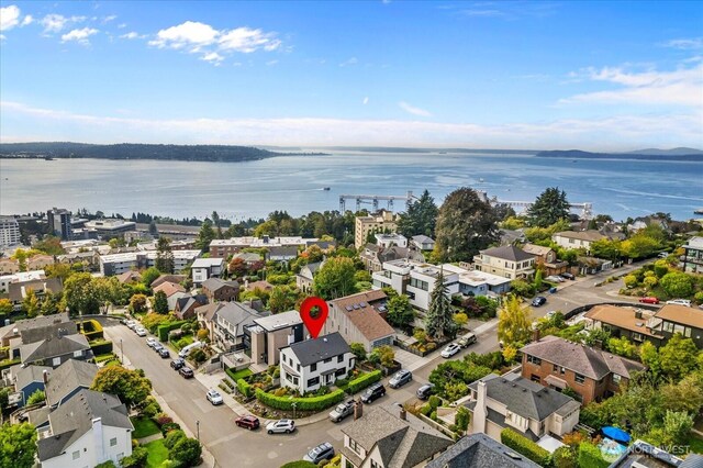 aerial view with a residential view and a water view