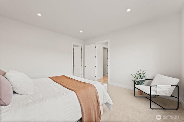 bedroom featuring recessed lighting, baseboards, and light carpet