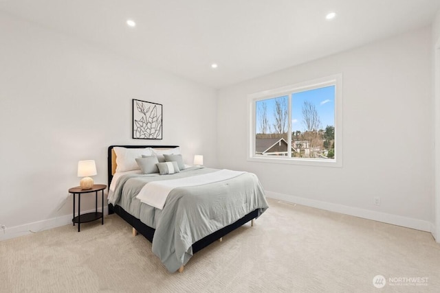 bedroom with recessed lighting, baseboards, and light carpet