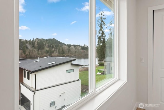 interior space featuring a water view and a wealth of natural light