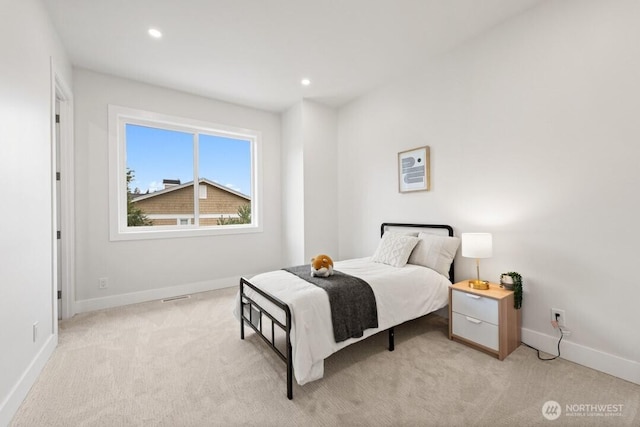 bedroom with light carpet, visible vents, recessed lighting, and baseboards