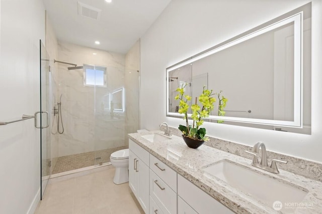 full bath with a sink, visible vents, toilet, and a marble finish shower