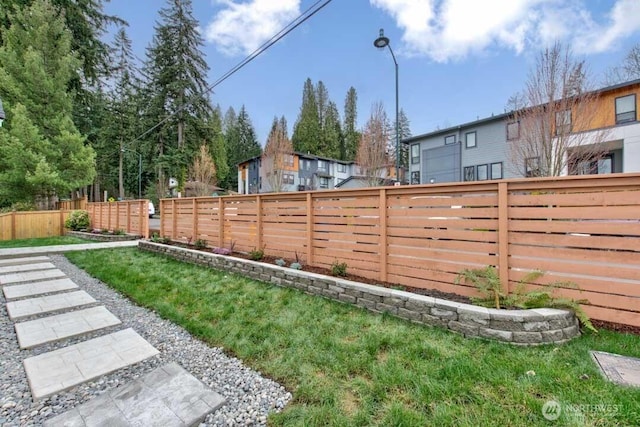 view of yard featuring a fenced backyard