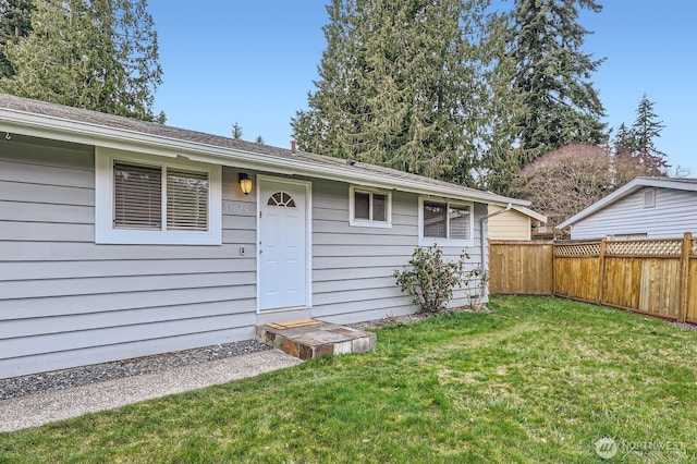 exterior space featuring a yard and fence