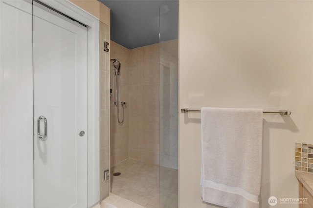 bathroom featuring a shower stall