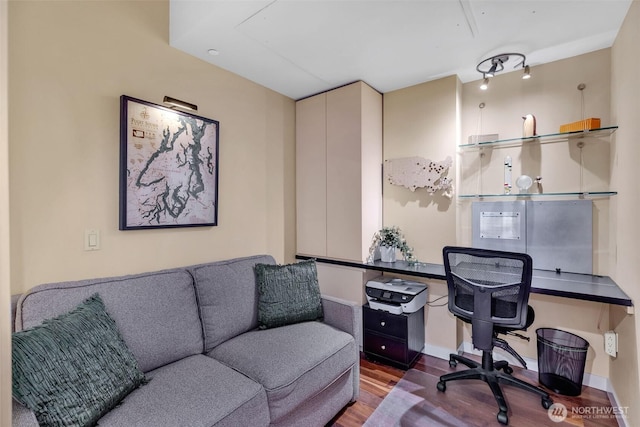 home office featuring wood finished floors and baseboards