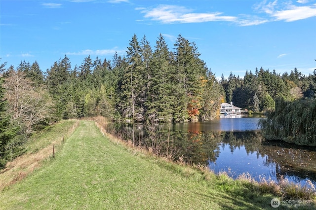 view of water feature with a view of trees