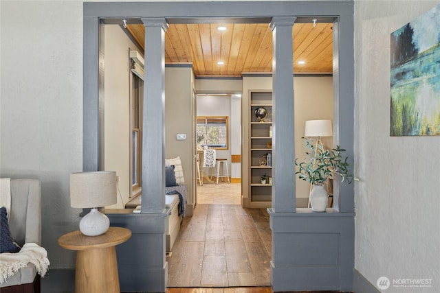 interior space with recessed lighting, decorative columns, wood-type flooring, and wood ceiling