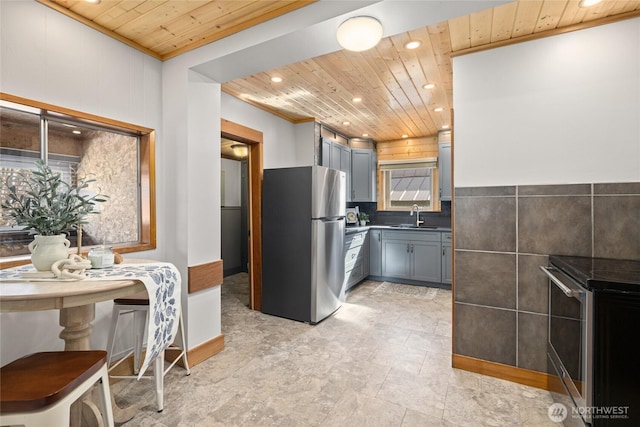 kitchen featuring recessed lighting, gray cabinets, appliances with stainless steel finishes, wooden ceiling, and a sink