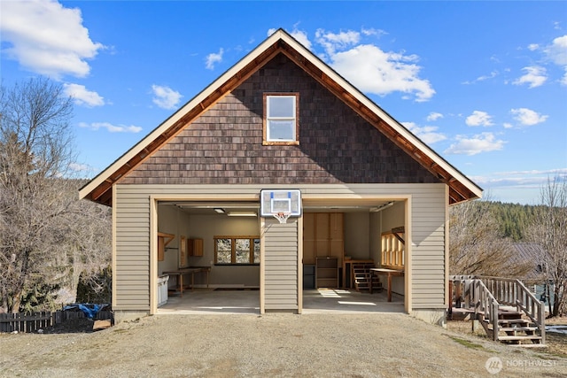 detached garage with a wall mounted air conditioner