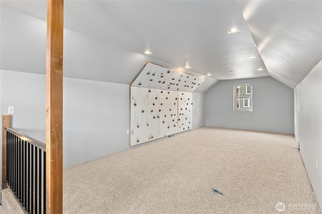 bonus room with recessed lighting, carpet, and vaulted ceiling