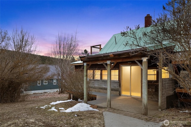 exterior space with metal roof