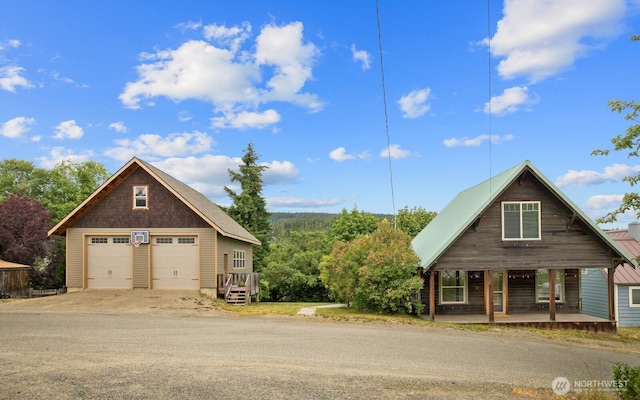 313 S 2nd St, Roslyn, WA 98941 - view of front of house featuring covered porch and a detached garage