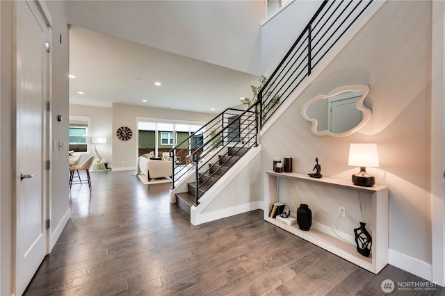 staircase with recessed lighting, baseboards, and wood-type flooring