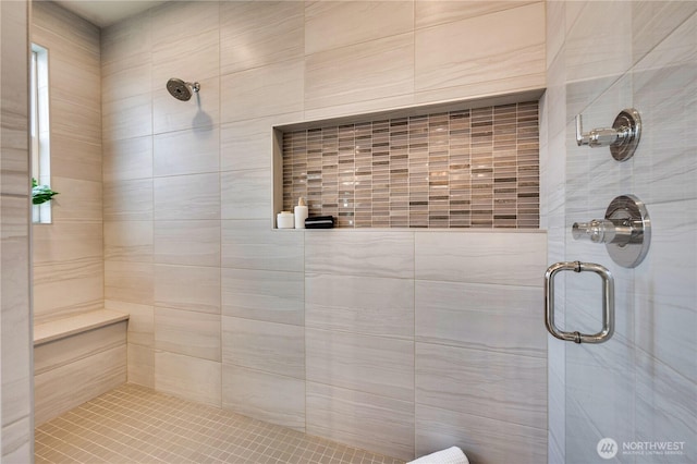 full bath featuring tiled shower