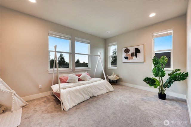 bedroom with recessed lighting, baseboards, and carpet floors