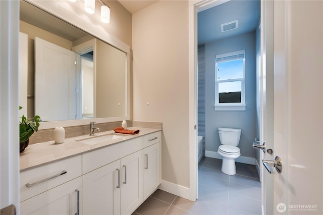 full bathroom featuring vanity, baseboards, visible vents, tile patterned floors, and toilet