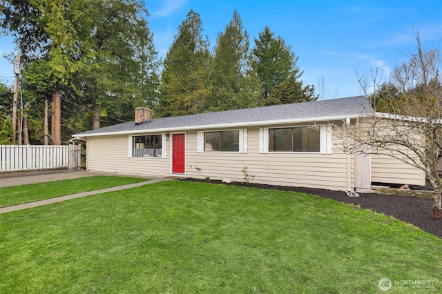 ranch-style home with a shingled roof, a chimney, a front yard, and fence