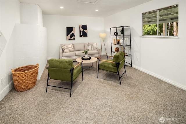 carpeted living room featuring recessed lighting, attic access, and baseboards