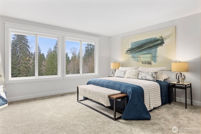 bedroom with carpet and baseboards