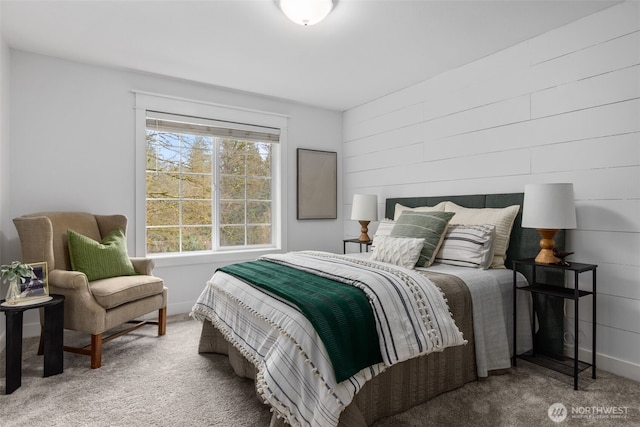 carpeted bedroom featuring baseboards