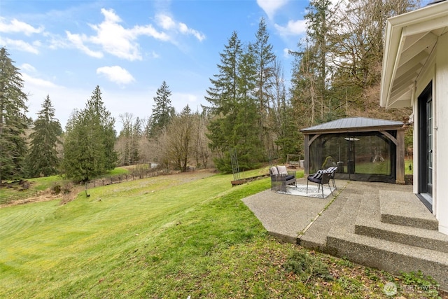 view of yard with a gazebo and a patio area