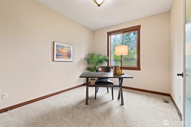 home office with visible vents, light colored carpet, and baseboards