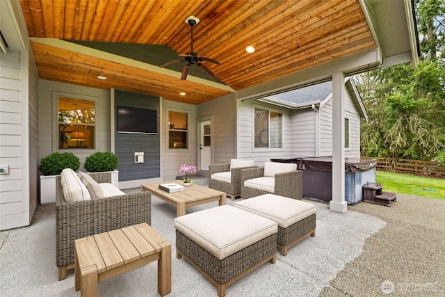 view of patio / terrace featuring an outdoor hangout area, a hot tub, ceiling fan, and fence