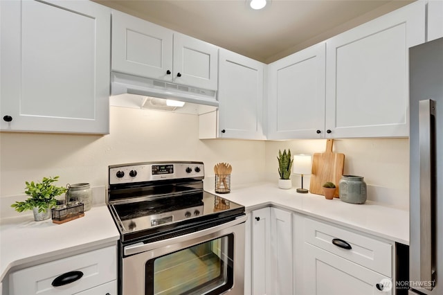 kitchen featuring under cabinet range hood, stainless steel range with electric stovetop, white cabinetry, and light countertops