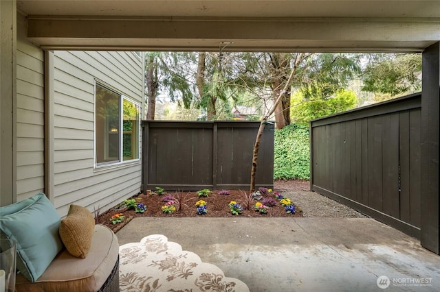 view of patio / terrace featuring fence