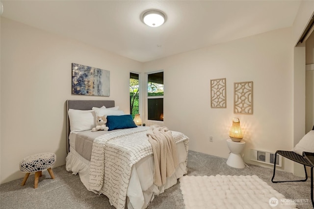 carpeted bedroom with visible vents