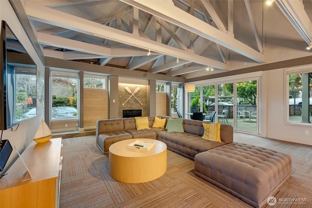 sunroom with a fireplace and vaulted ceiling with beams