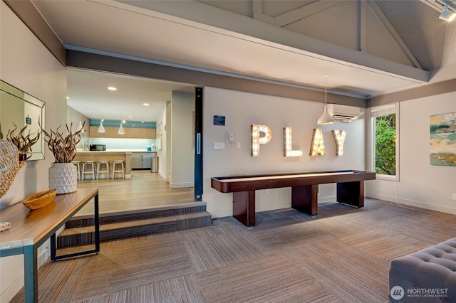 playroom featuring a wall unit AC, recessed lighting, carpet, baseboards, and vaulted ceiling