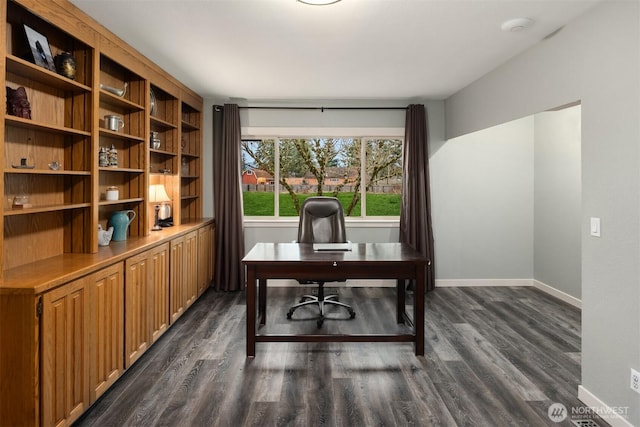 office space featuring baseboards and dark wood-style flooring